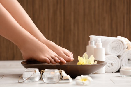 Woman undergoing spa pedicure treatment in salon, closeupの写真素材