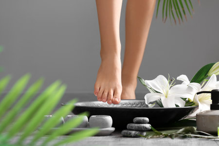 Woman undergoing spa pedicure treatment in salon, closeupの写真素材