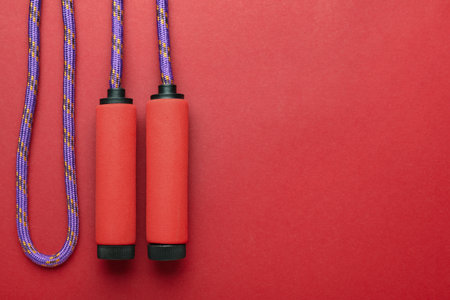 Skipping rope on red backgroundの写真素材