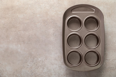 Muffin tray on grunge backgroundの写真素材