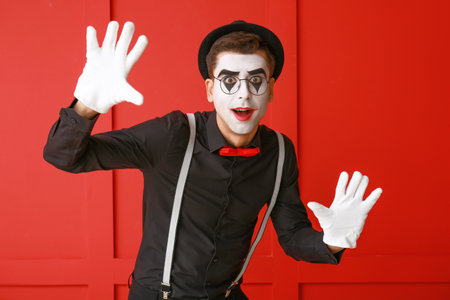 Male pantomimist on color backgroundの写真素材