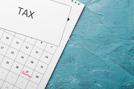 Calendar with word TAX on color backgroundの写真素材