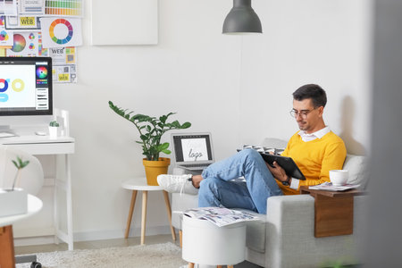 Graphic designer working in officeの写真素材