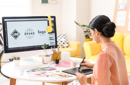 Graphic designer working in officeの写真素材