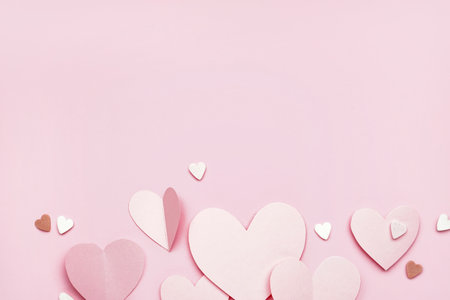 Composition with paper hearts on pink background. valentine's day celebrationの写真素材