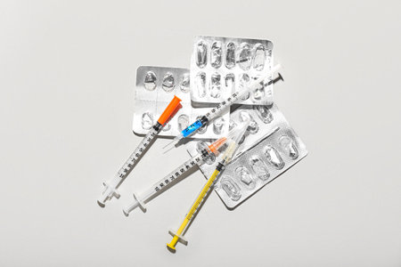 Medical syringes with empty blisters on light backgroundの写真素材