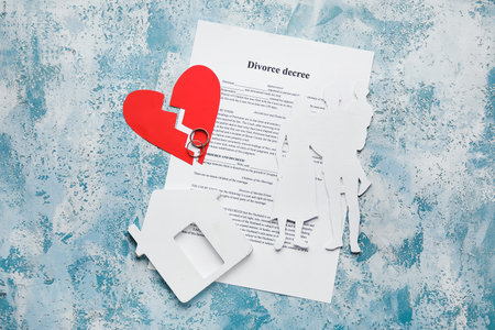 Figures of family with broken heart and divorce decree on color backgroundの写真素材