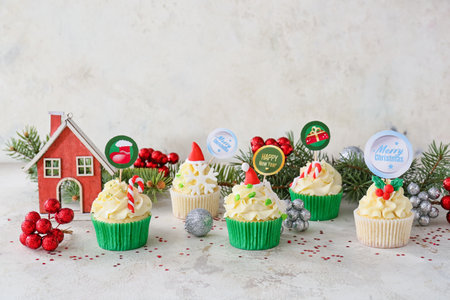 Composition with tasty Christmas cupcakes on tableの写真素材