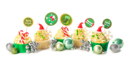 Tasty Christmas cupcakes on white backgroundの写真素材