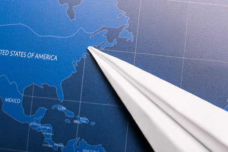 paper airplane on world mapの写真素材