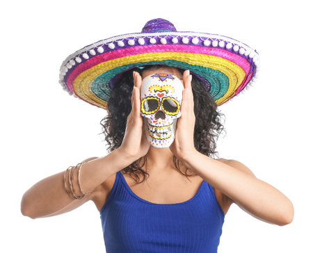 Beautiful woman in sombrero hat with skull on white backgroundの写真素材