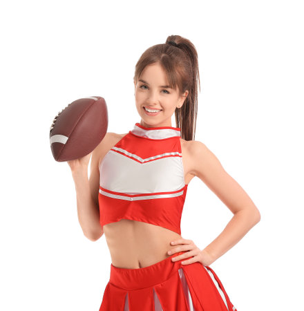 Beautiful young cheerleader with ball on white backgroundの写真素材