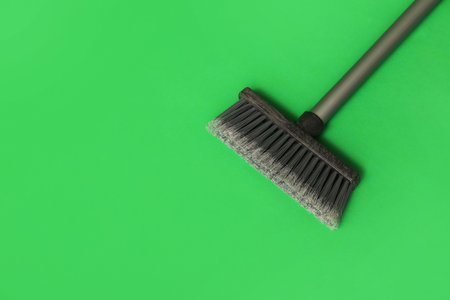 Cleaning broom on green backgroundの写真素材