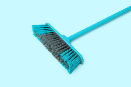 Cleaning broom on blue backgroundの写真素材