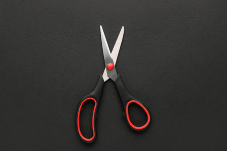 office scissors on dark background
