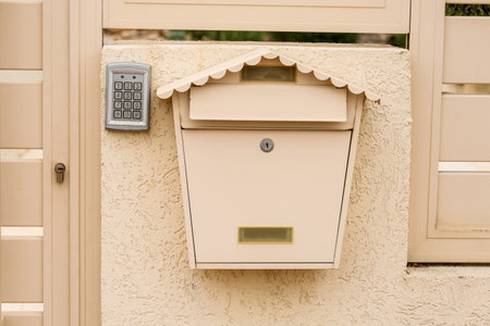 Modern fence with intercom and mailbox outdoorsの写真素材