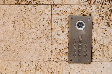 Modern intercom on stone wall, closeupの写真素材