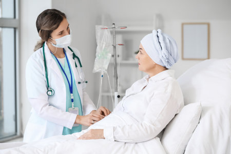 Doctor and mature woman undergoing chemical therapy course in clinicの写真素材
