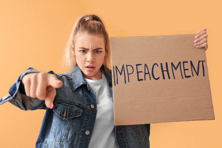 Protesting young woman on color background. impeachment concept