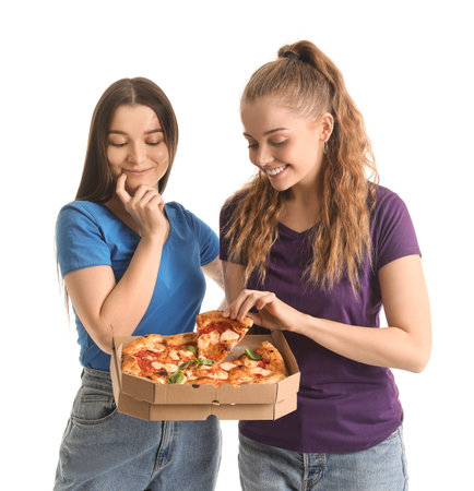 Young women with box of tasty pizza on white backgroundの写真素材