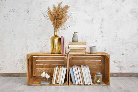 Wooden boxes with stack of books in the roomの写真素材