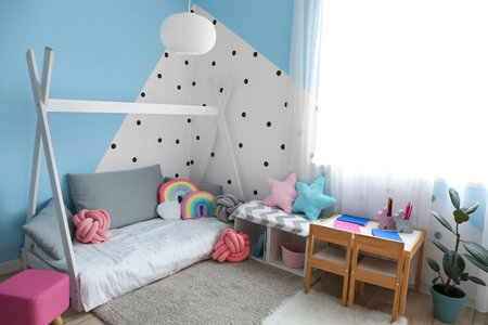 Interior of modern children's room with comfortable bedの写真素材