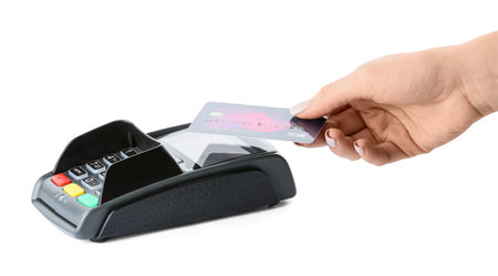 Female hand with credit card and payment terminal on white background