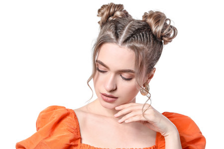 Beautiful young woman with braided hair on white background