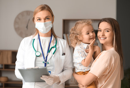 Pediatrician visiting little girl at homeの写真素材