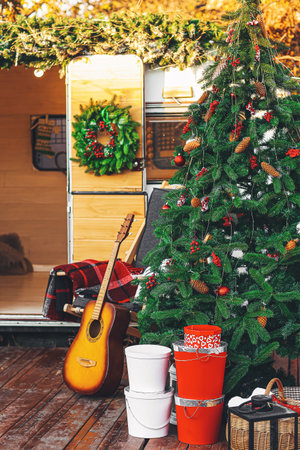 Decorated Christmas tree near motorhome outdoorsの写真素材