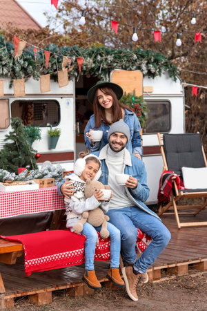 Happy family outdoors on christmas eveの写真素材