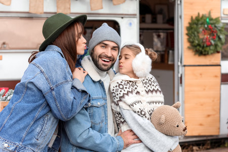 Happy family outdoors on christmas eveの写真素材