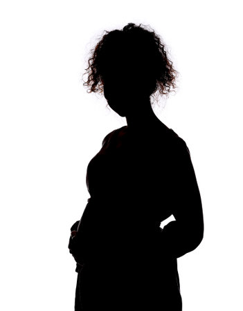 Silhouette of pregnant woman on white backgroundの写真素材