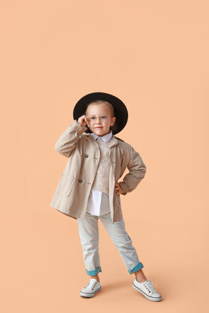 Portrait of stylish little girl on color backgroundの写真素材