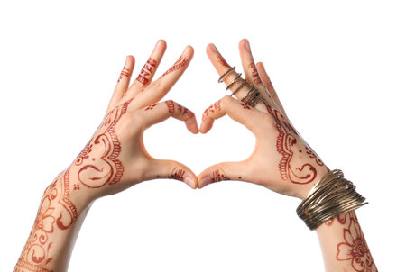 Beautiful female hands with henna tattoo on white background