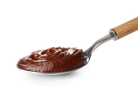 Spoon of delicious chocolate pudding isolated on white backgroundの写真素材