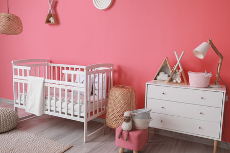 Interior of modern children's room with comfortable bed and chest of drawersの写真素材