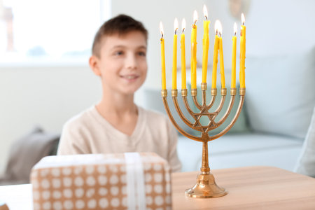 Happy boy celebrating Hannukah at homeの写真素材