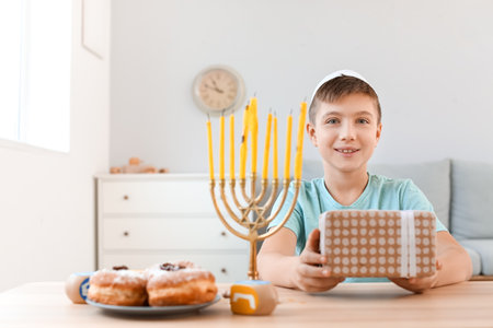 Happy boy celebrating Hannukah at homeの写真素材