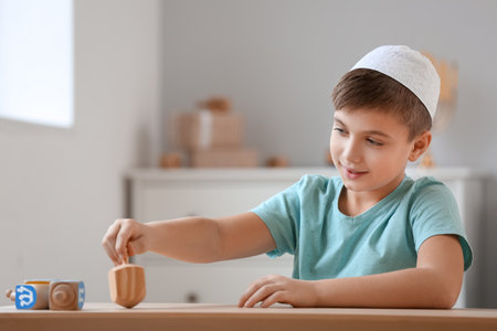 Happy boy celebrating Hannukah at homeの写真素材