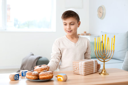 Happy boy celebrating Hannukah at homeの写真素材