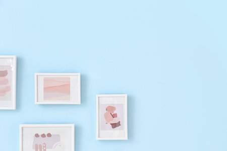 beautiful pictures hanging on color wallの写真素材