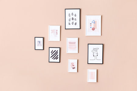beautiful pictures hanging on color wall