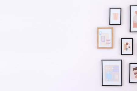 beautiful pictures hanging on light wall