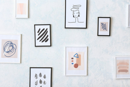 beautiful pictures hanging on light wallの写真素材