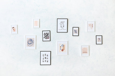 beautiful pictures hanging on light wallの写真素材