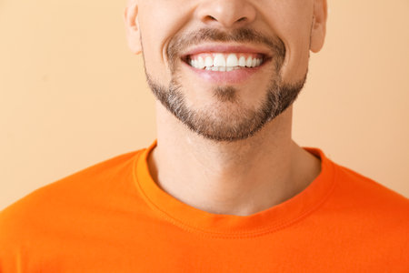 Smiling man on color backgroundの写真素材
