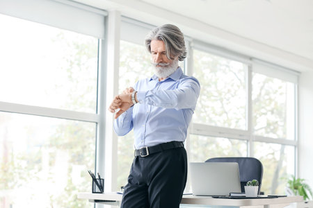 senior businessman working in officeの写真素材