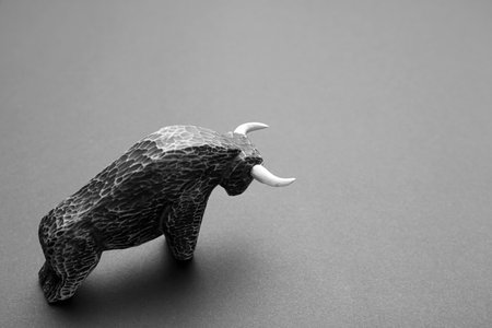Figurine of bull on dark backgroundの写真素材