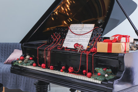 Grand piano decorated for Christmas in roomの写真素材
